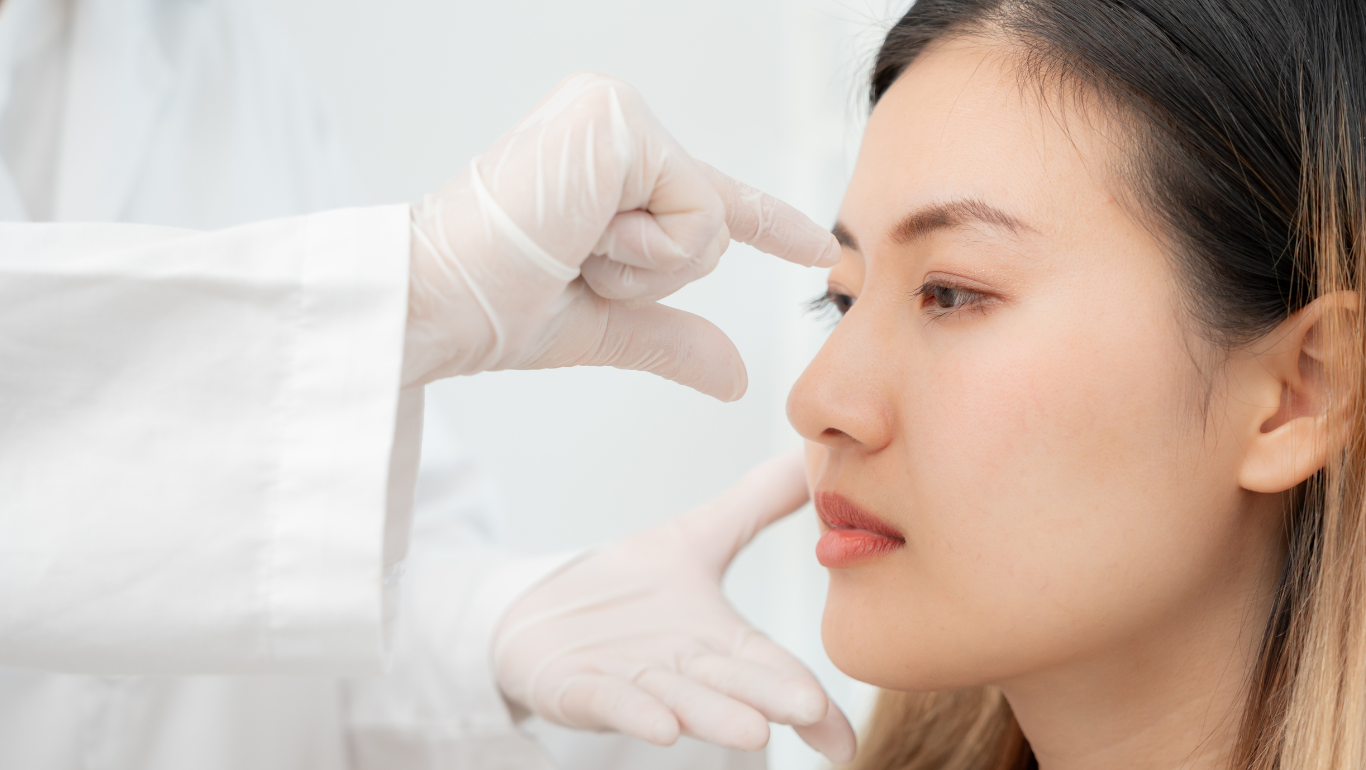 Plastic surgeon assessing a patient before a Rhinoplasty in Sydney, also known as a Nose Job